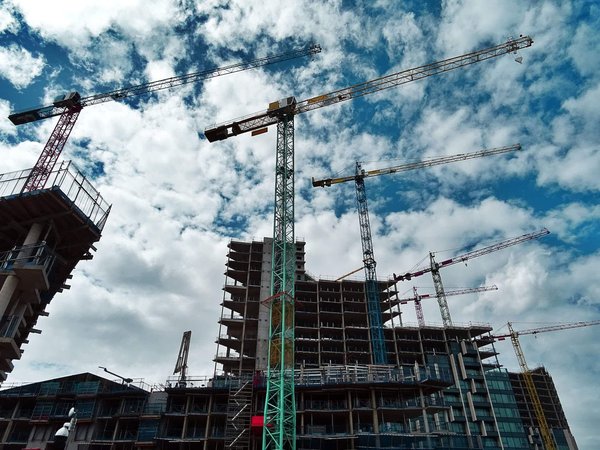 What are the emerging trends in the use of sustainable materials in real estate construction?